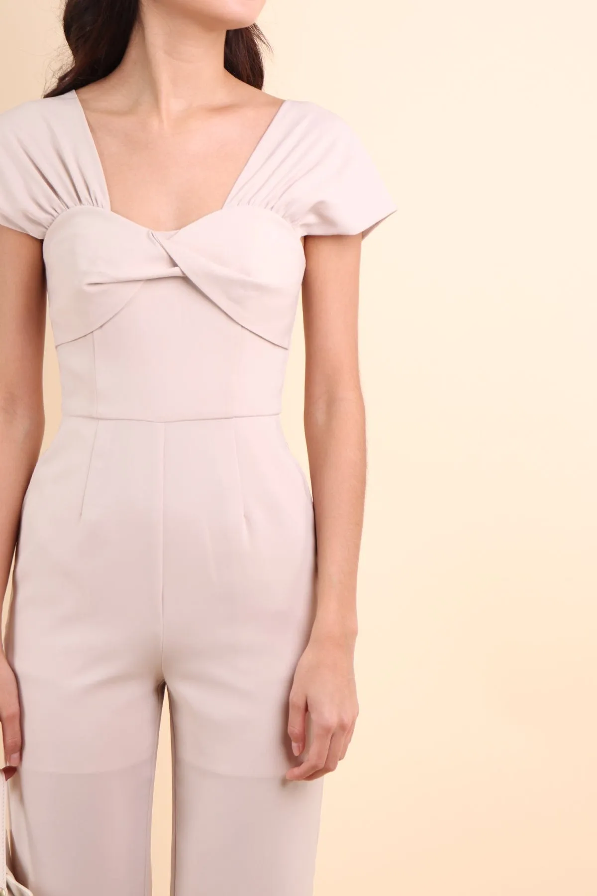 MIRANDA TWIST-DETAIL JUMPSUIT IN ECRU BEIGE