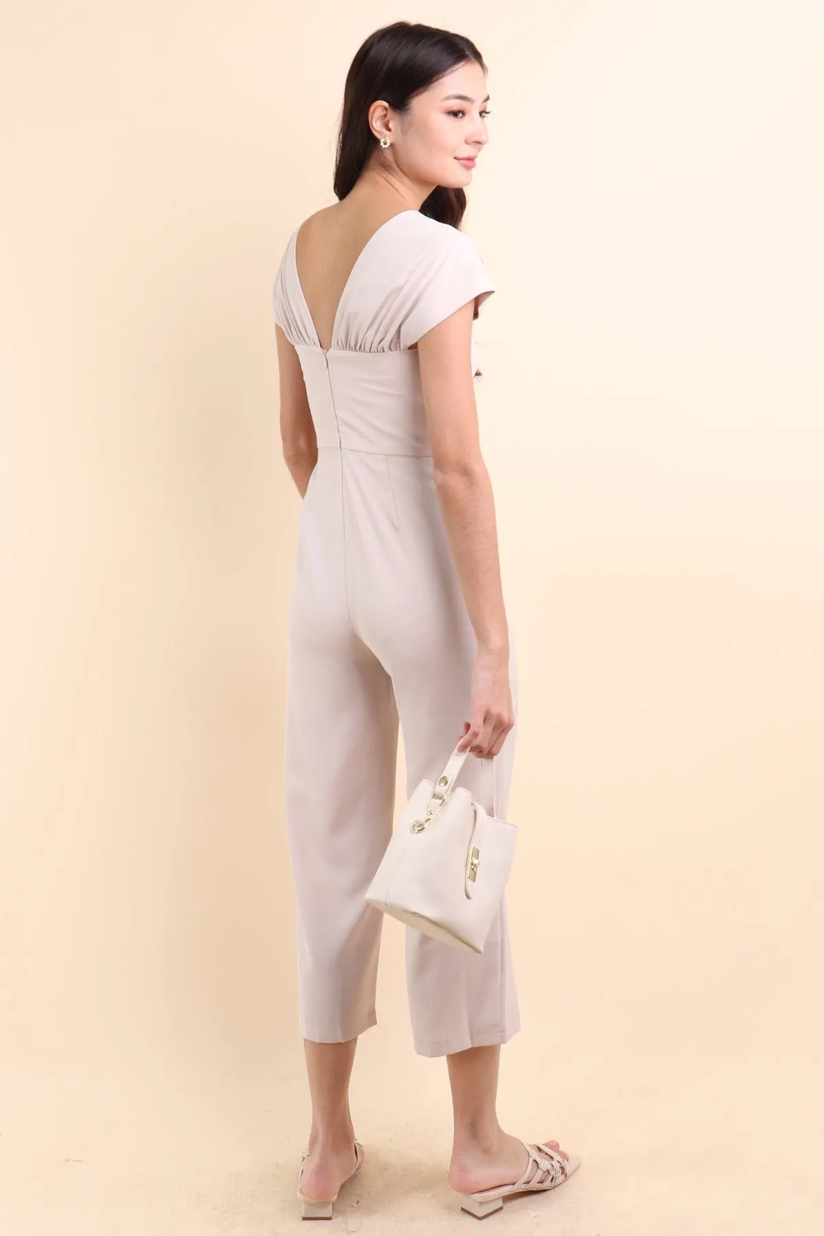 MIRANDA TWIST-DETAIL JUMPSUIT IN ECRU BEIGE