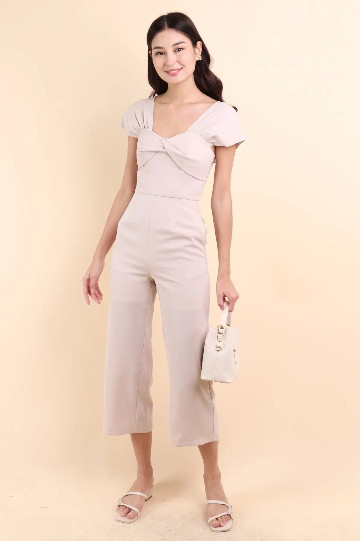 MIRANDA TWIST-DETAIL JUMPSUIT IN ECRU BEIGE